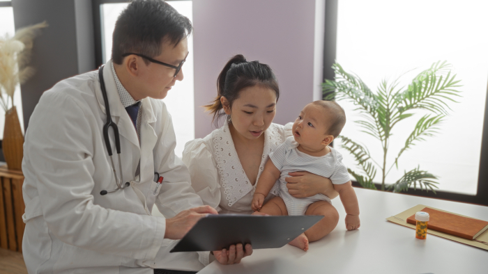 Mother with a baby in doctor's clinic