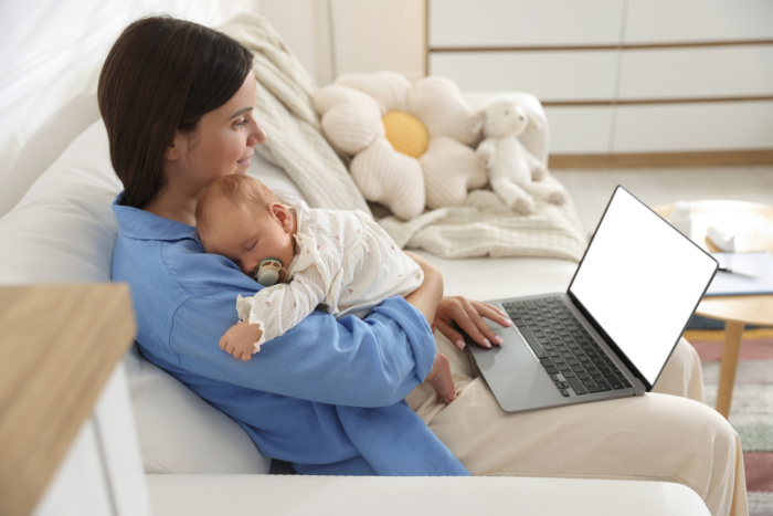 woman with a baby and laptop